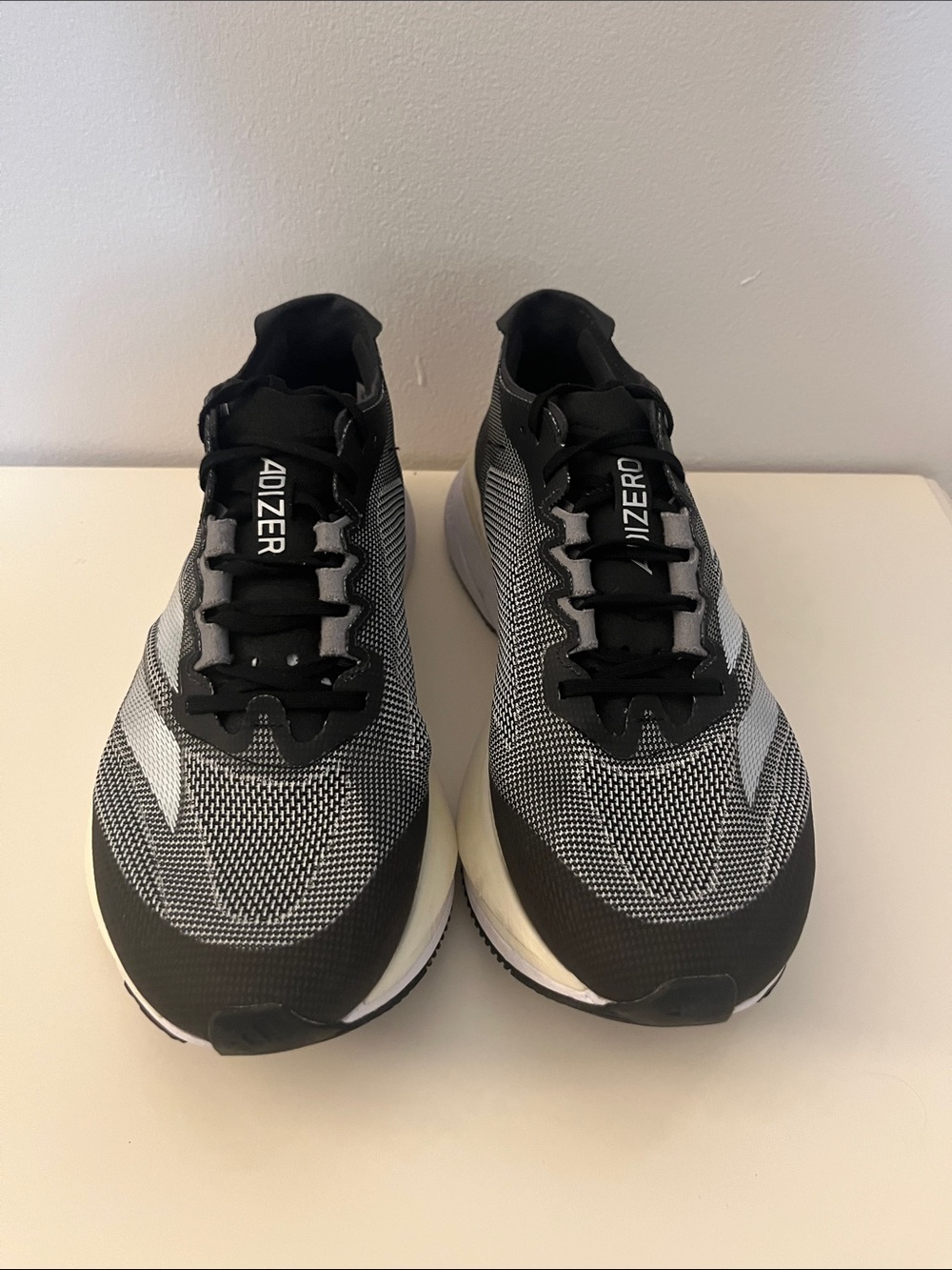 adidas Adizero women’s Black & White Running Sneakers